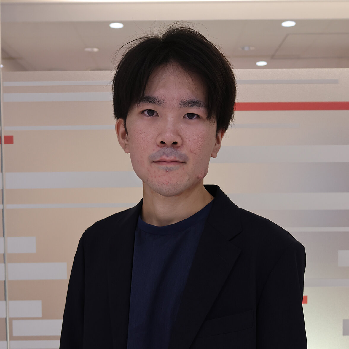 新倉 修真.jpg